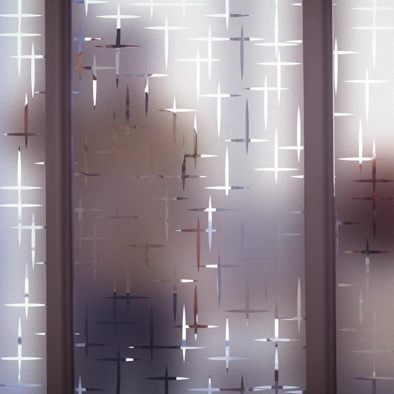 Custom frosted vinyl sticker on glass window, featuring a unique etched design for elegance and privacy.