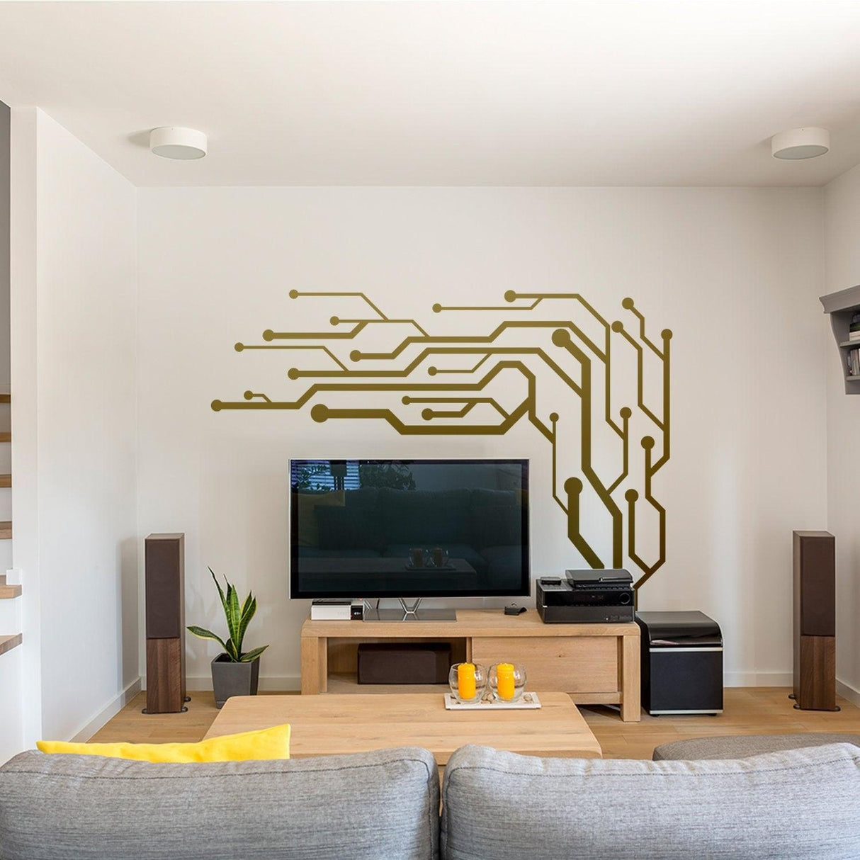Stylish vinyl decal wall art with circuit design above a TV in a modern living room decor.