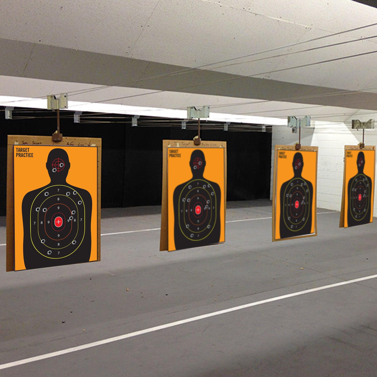 Large outdoor human silhouette shooting targets for practice with rifles, handguns, and airsoft in a shooting range.