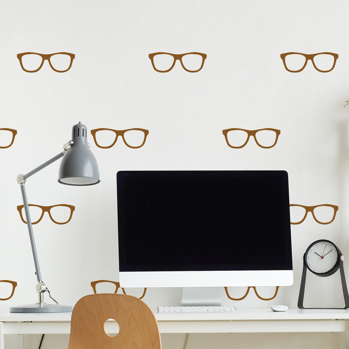 Wall decorated with 50x glasses wall decals in a stylish home office setting.