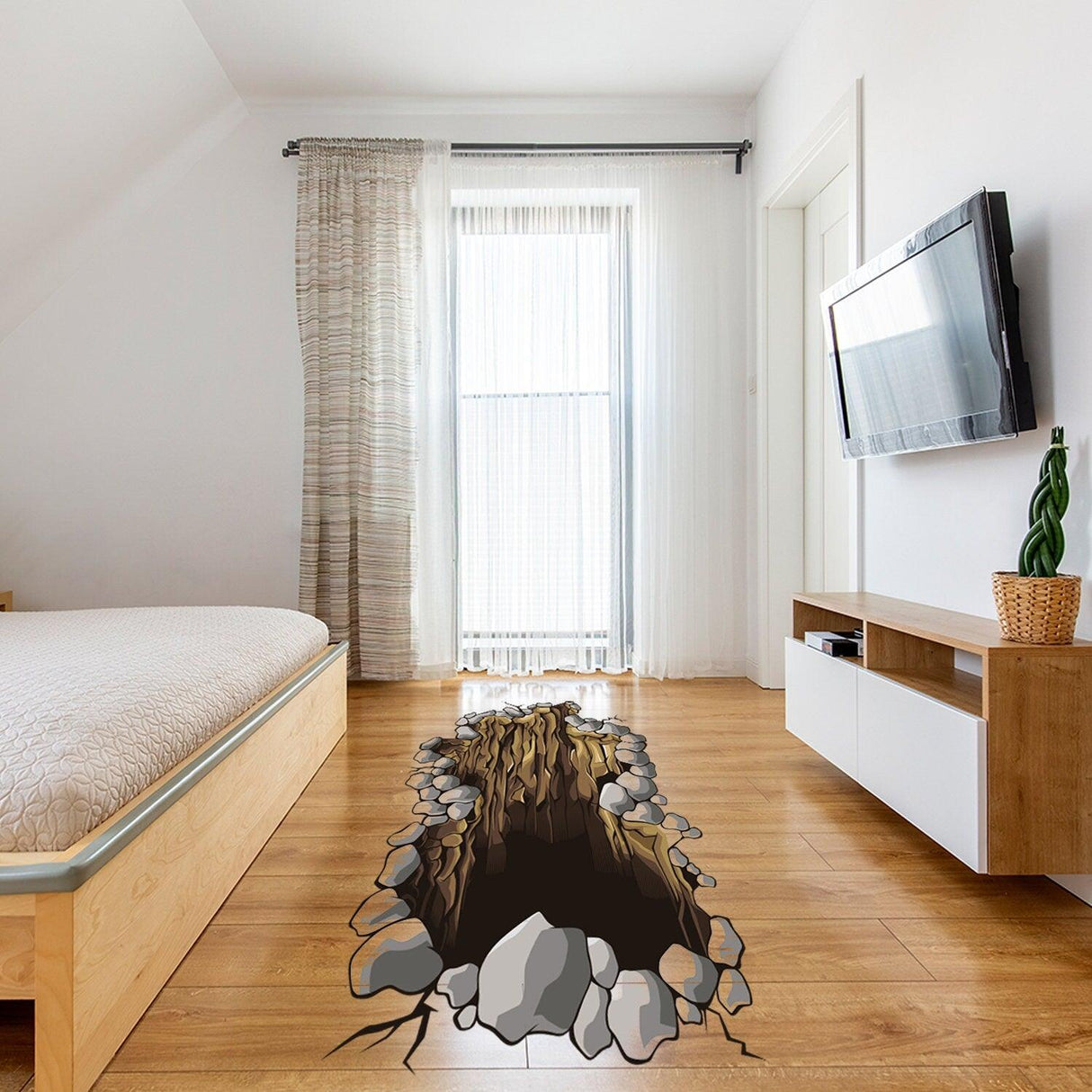 3D floor sticker of a hole with rocks, creating an illusion in a modern living room setting.