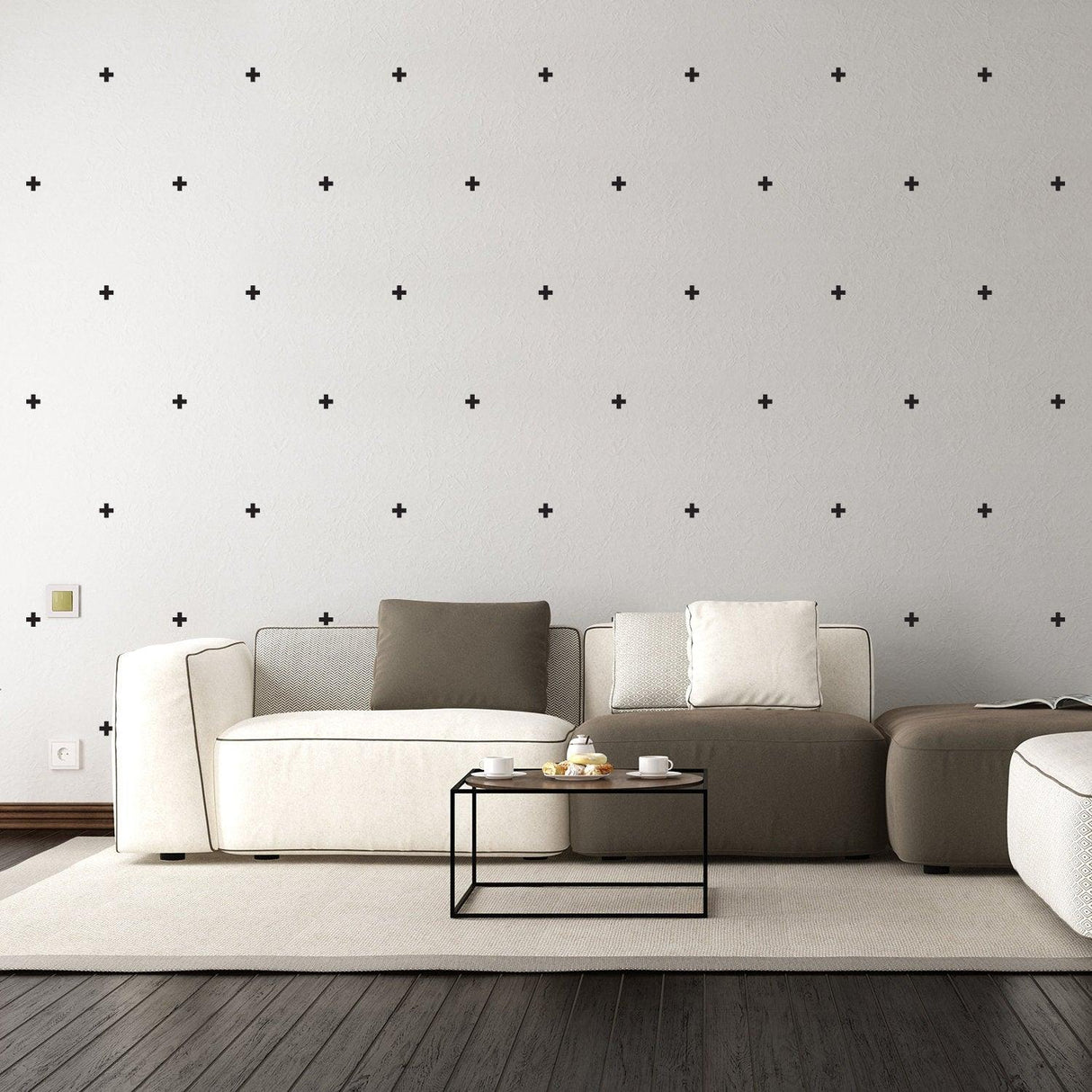 Stylish living room featuring 50x Cross Sticker Vinyl Wall Decor in black on a gray wall above a modern sofa.