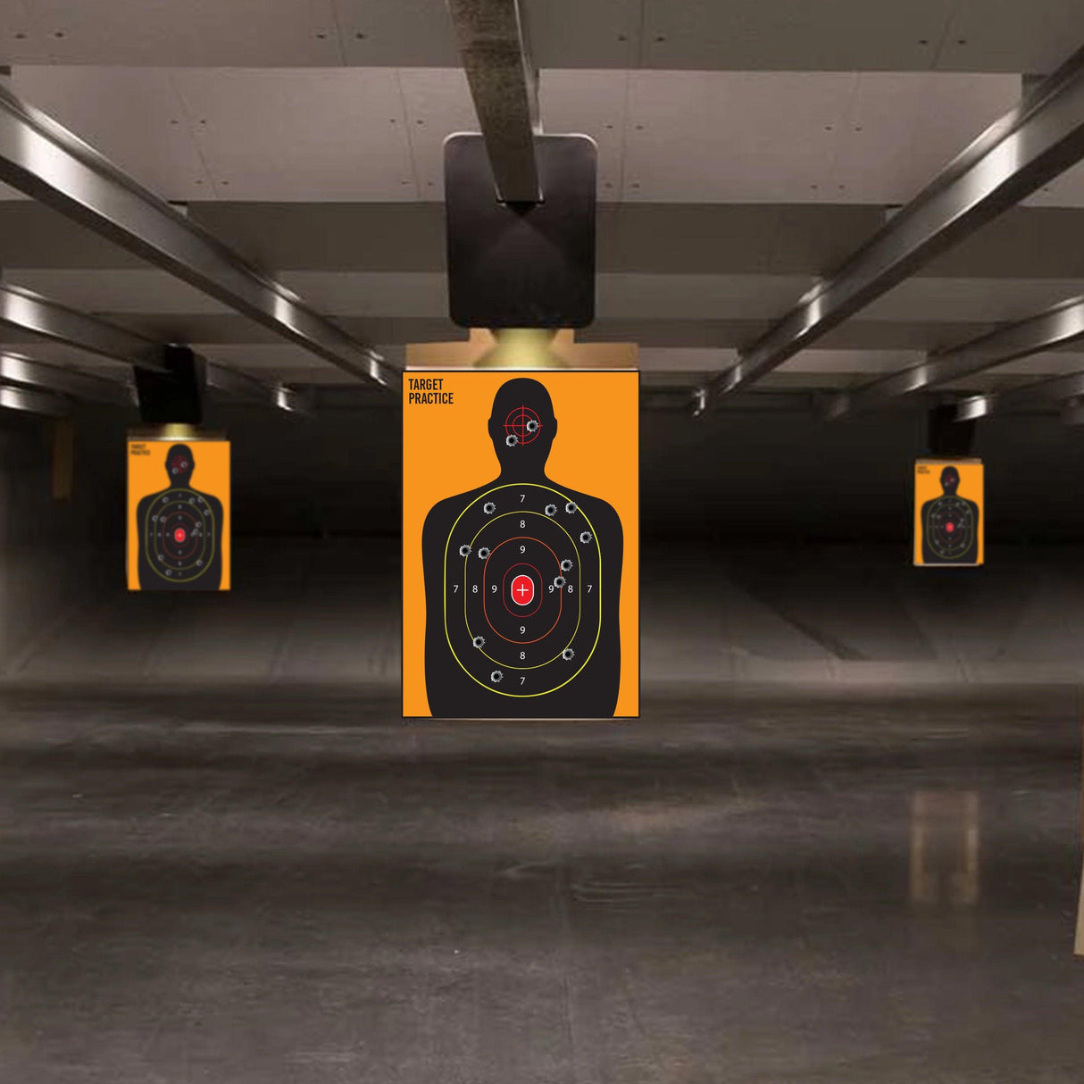 Indoor shooting range with large human silhouette shooting targets for firearm practice.