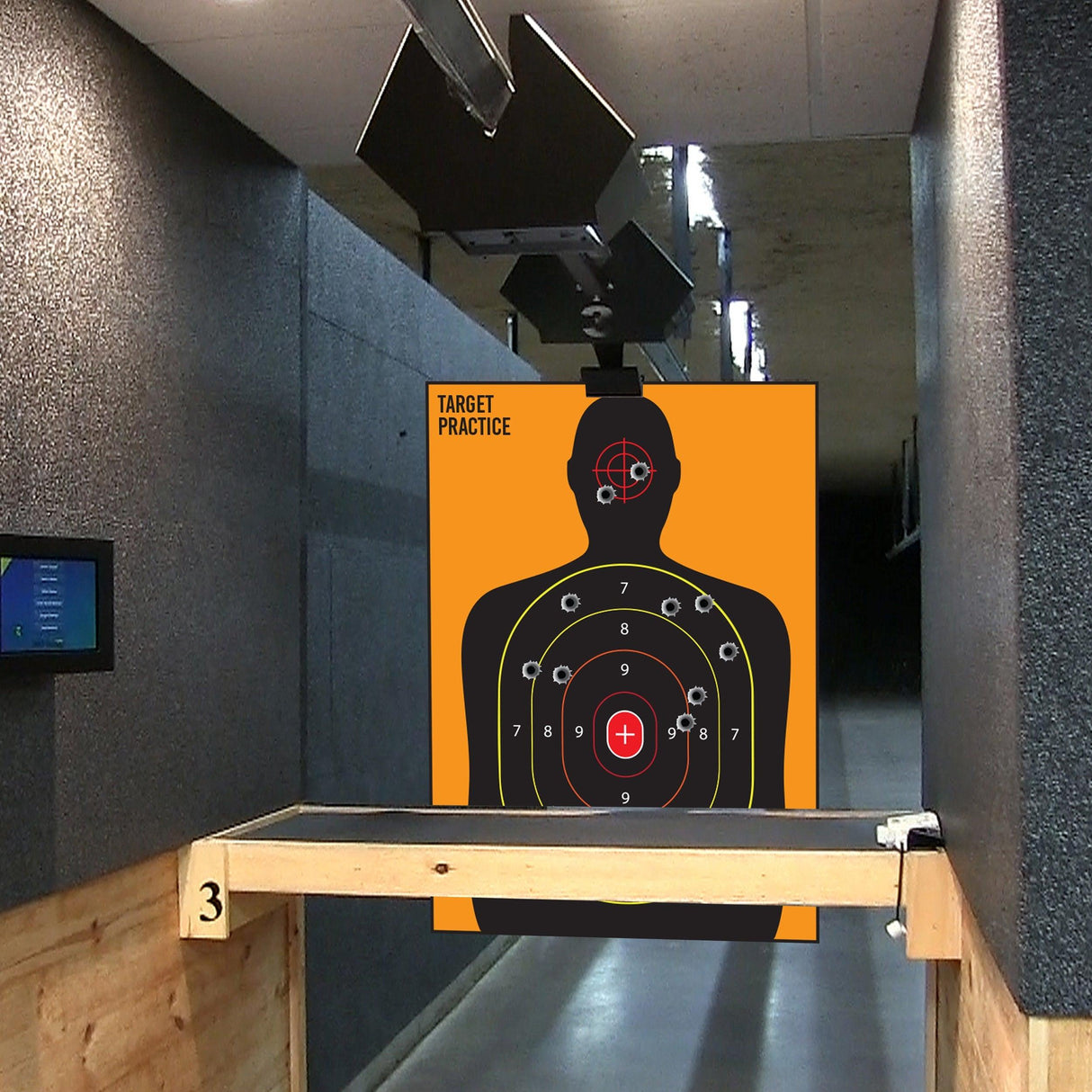 Large silhouette target for shooting practice in an indoor range, featuring scoring zones for accuracy training.