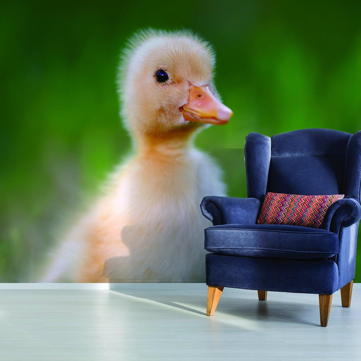 Adorable duckling mural backdrop in a cozy bedroom with a stylish blue chair.