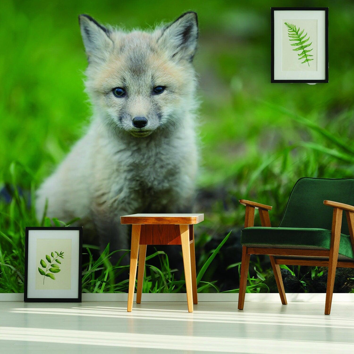 Cute little fox wallpaper decor in a stylish room with green accents and framed botanical art.