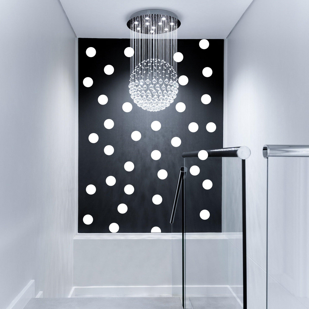 Stylish hallway featuring white circle wall stickers on a black background with a modern chandelier.