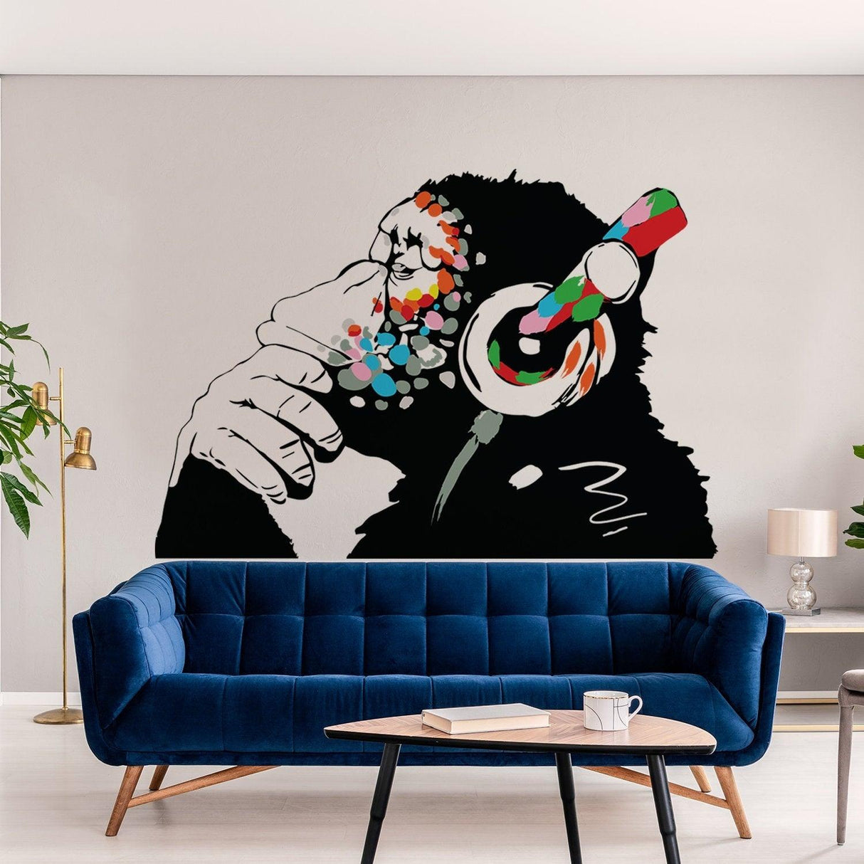 Colorful monkey wall art decal with headphones in modern living room design, showcasing urban style.