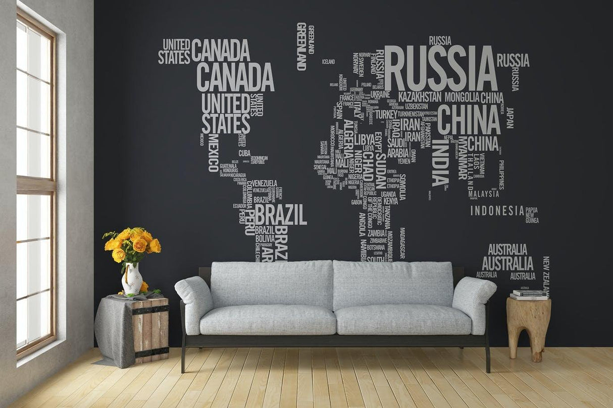 Stylish living room featuring a world map wall decal made of text representing countries on a dark background.