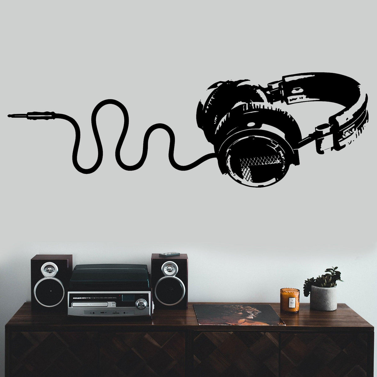 Cool vinyl DJ headphones wall decal with a cable design, perfect for a teen boy's music-themed room decor.