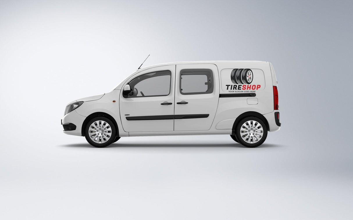 White tire shop van with logo and wheels graphics on the side, parked against a neutral background.