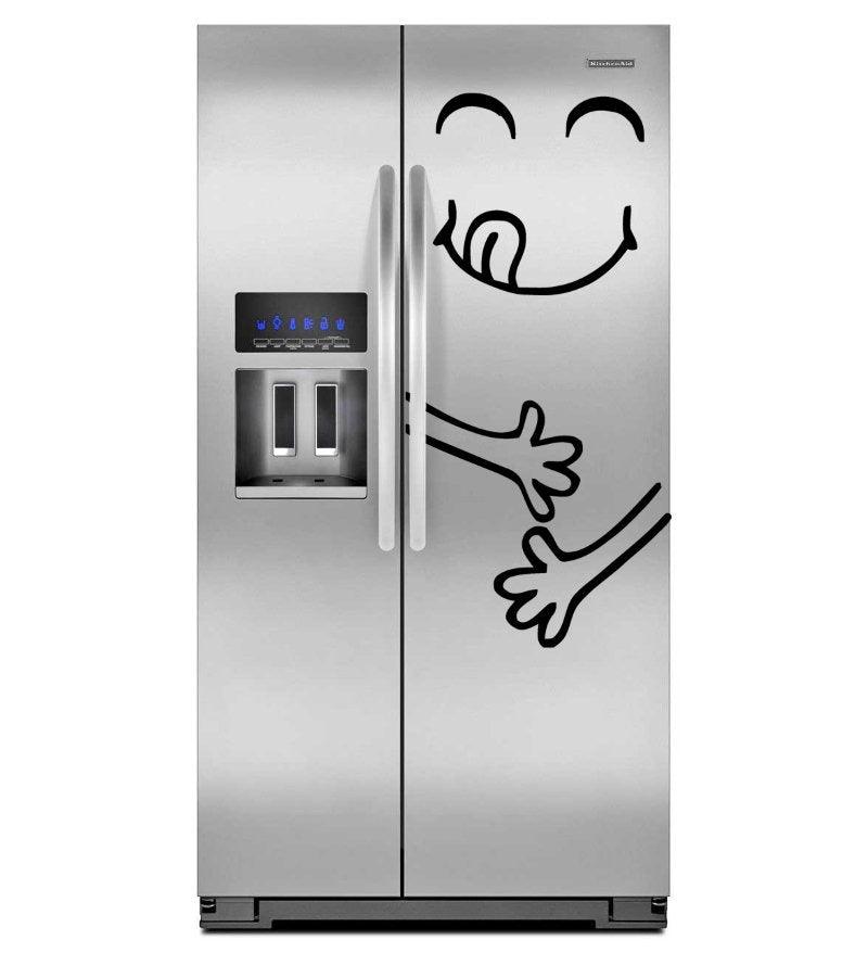 Funny happy face vinyl decal on a stainless steel refrigerator, adding a playful touch to kitchen decor.