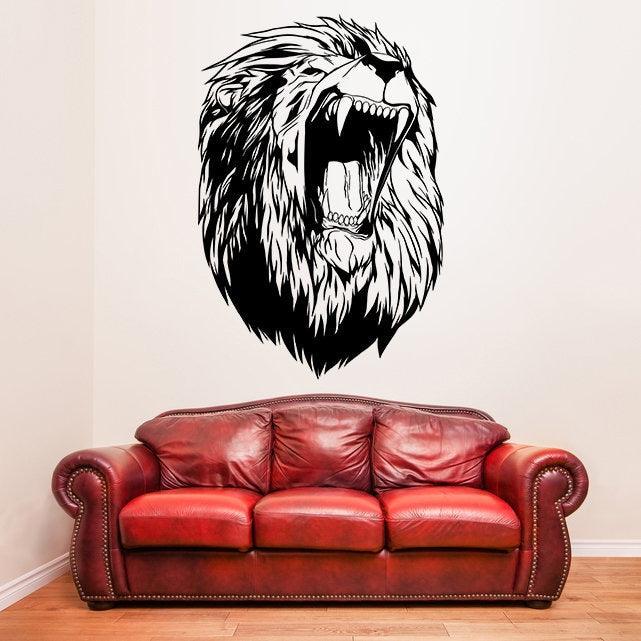 Large lion head wall decal above a red leather couch in a stylish living room setting.