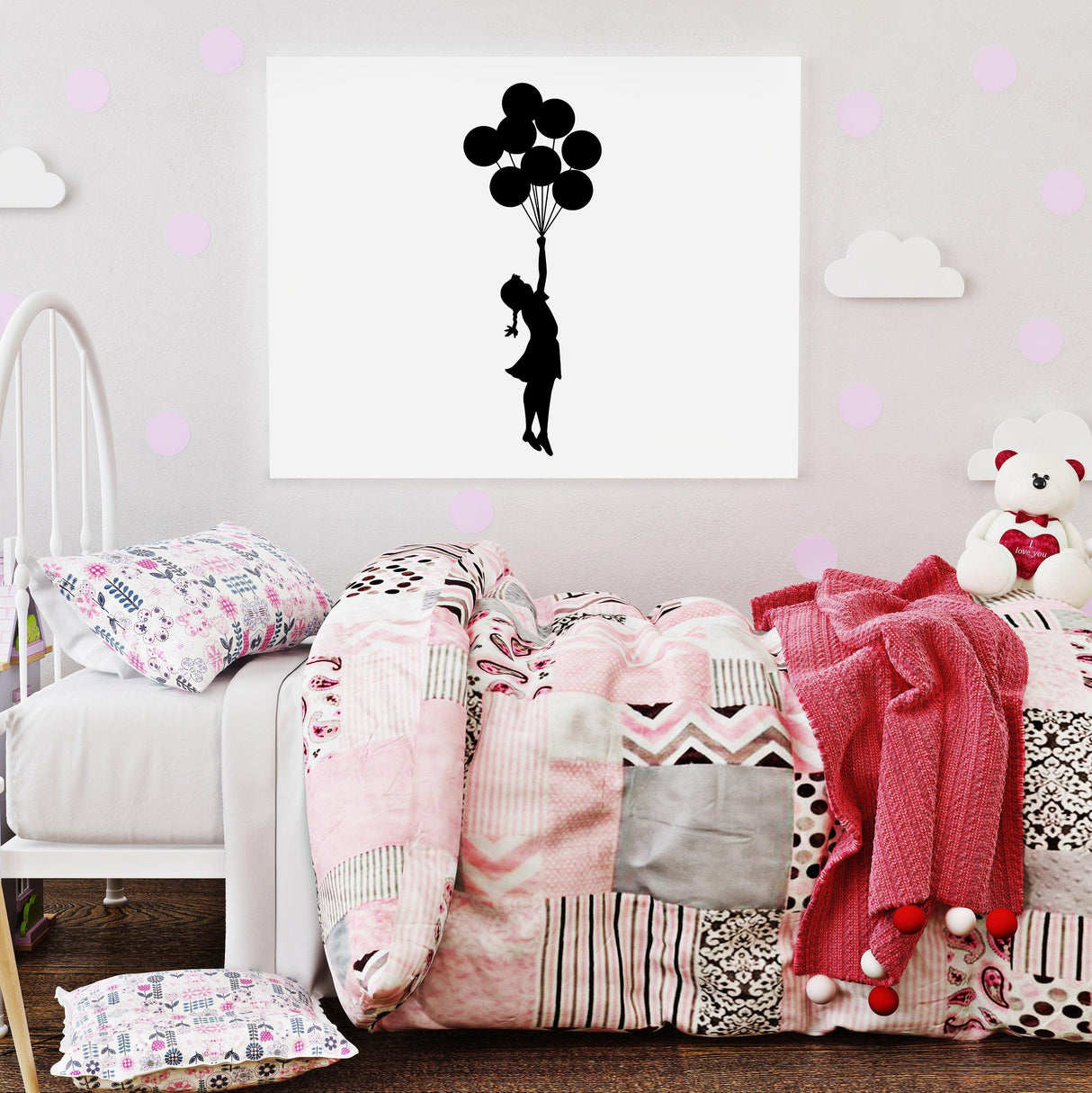 Banksy Girl With Balloons wall decal in a stylish bedroom setting with colorful bedding.