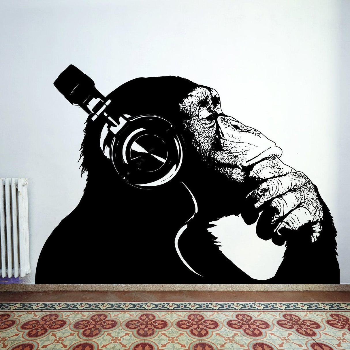 Banksy-inspired monkey with headphones wall sticker, adding creative flair to any room.