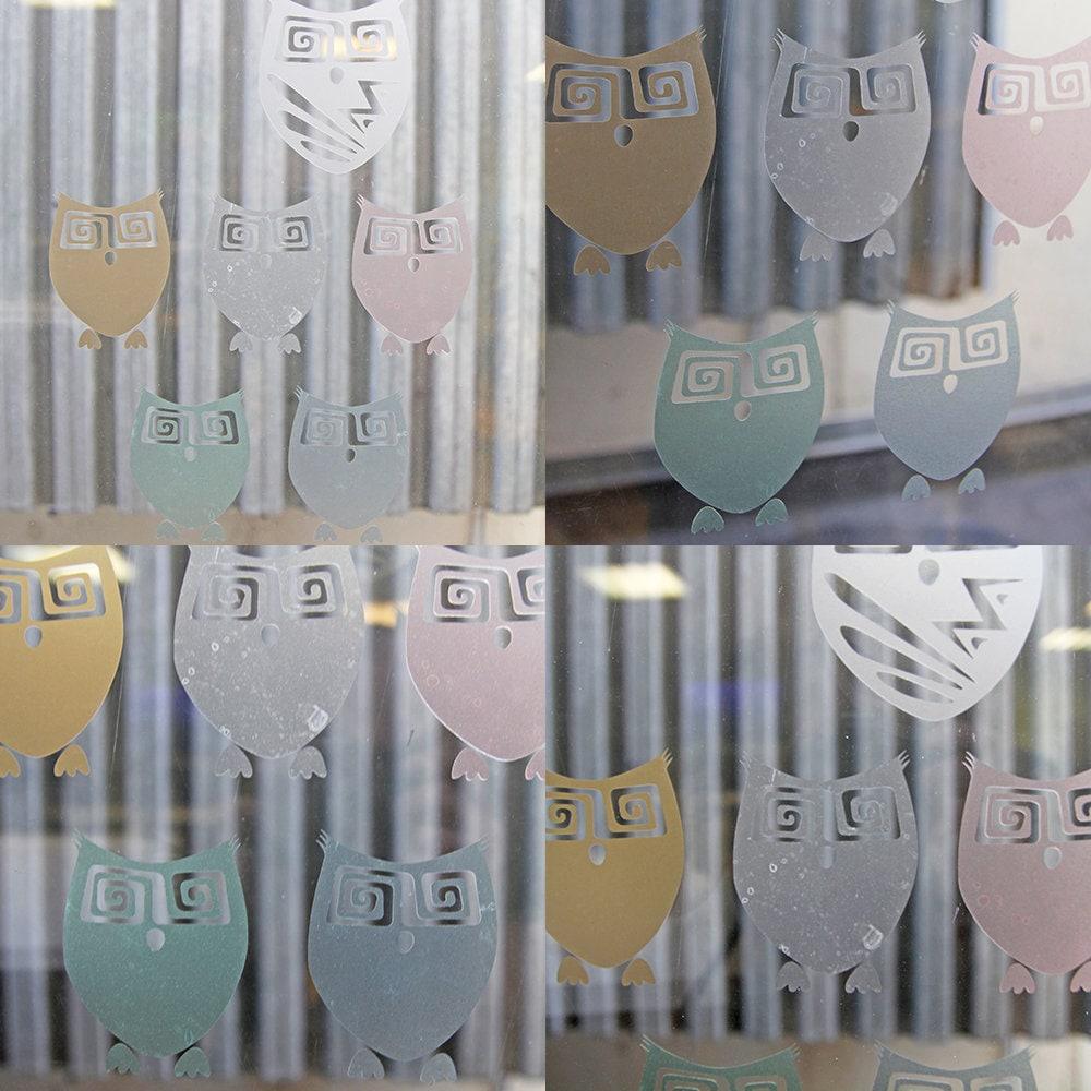 Custom frosted window film decal featuring cute owl designs in pastel colors for glass doors.
