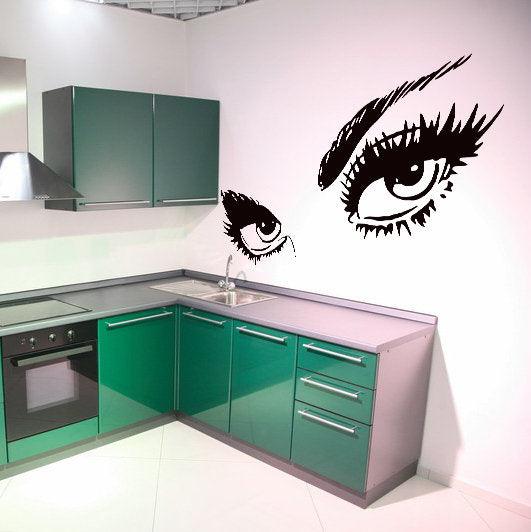 Beautiful female eye decal on kitchen wall, adding elegance and style to modern decor.