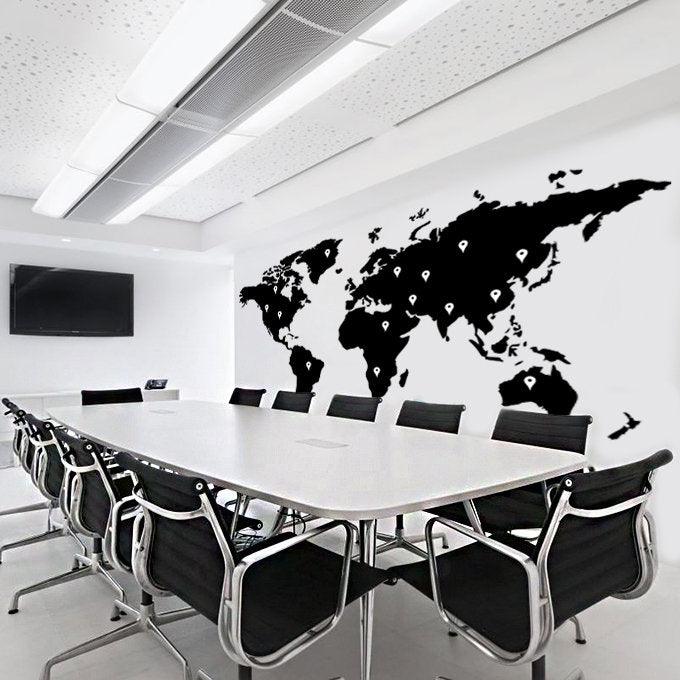 World map wall decal in a modern conference room with a large table and black chairs, perfect for office decor.