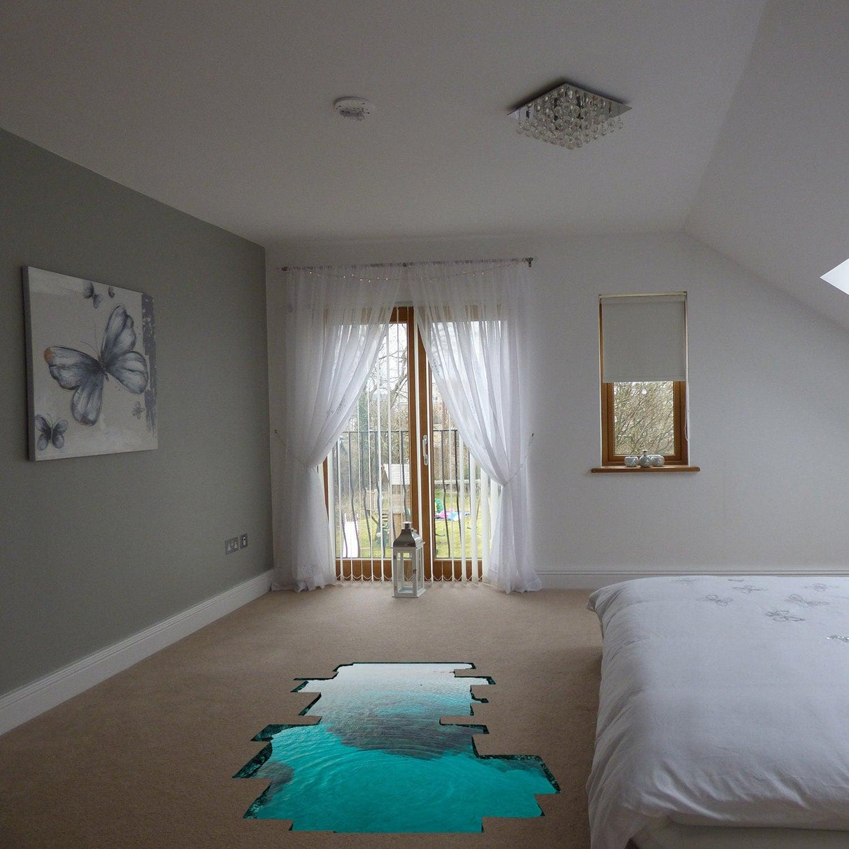 3D ocean floor decal in a stylish bedroom with butterfly art and sunlight streaming in through the windows.