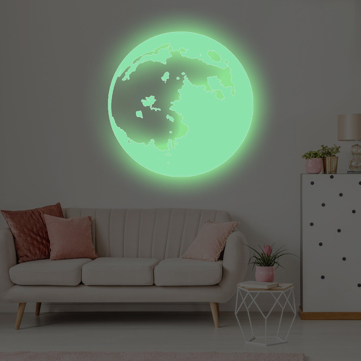 Glow in the dark moon wall sticker illuminating a cozy living room, ideal for children's bedrooms and playrooms.
