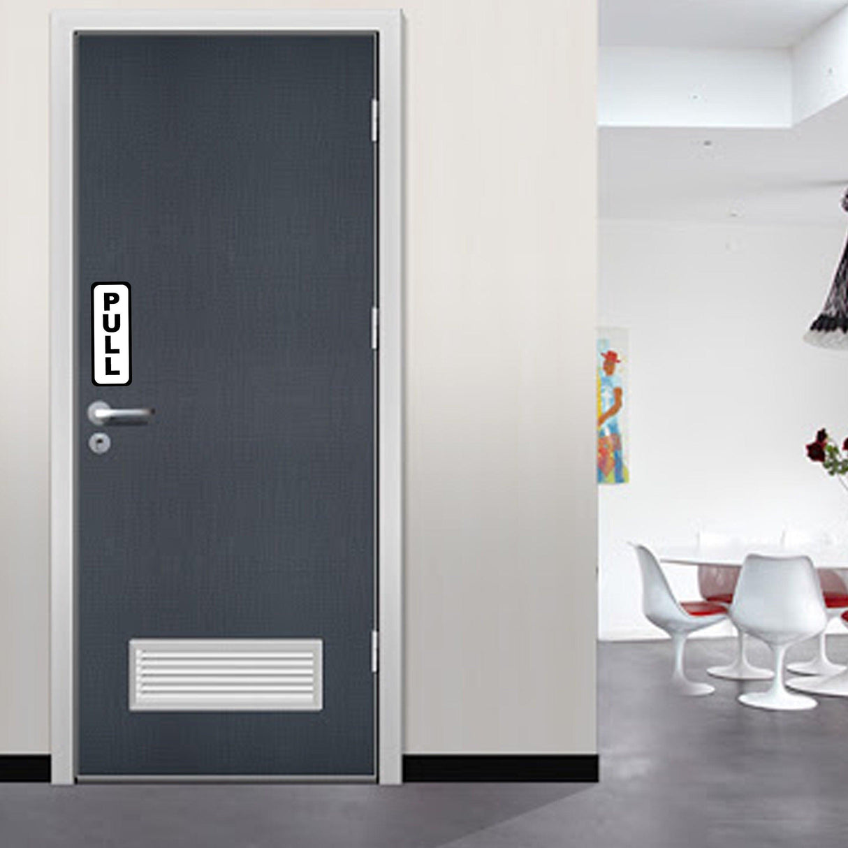 Interior view of a door with a vertical 'PULL' sign, designed for easy use in commercial spaces.