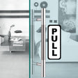 Push pull door vertical sticker sign with 'PULL' text on sleek glass door in modern interior.