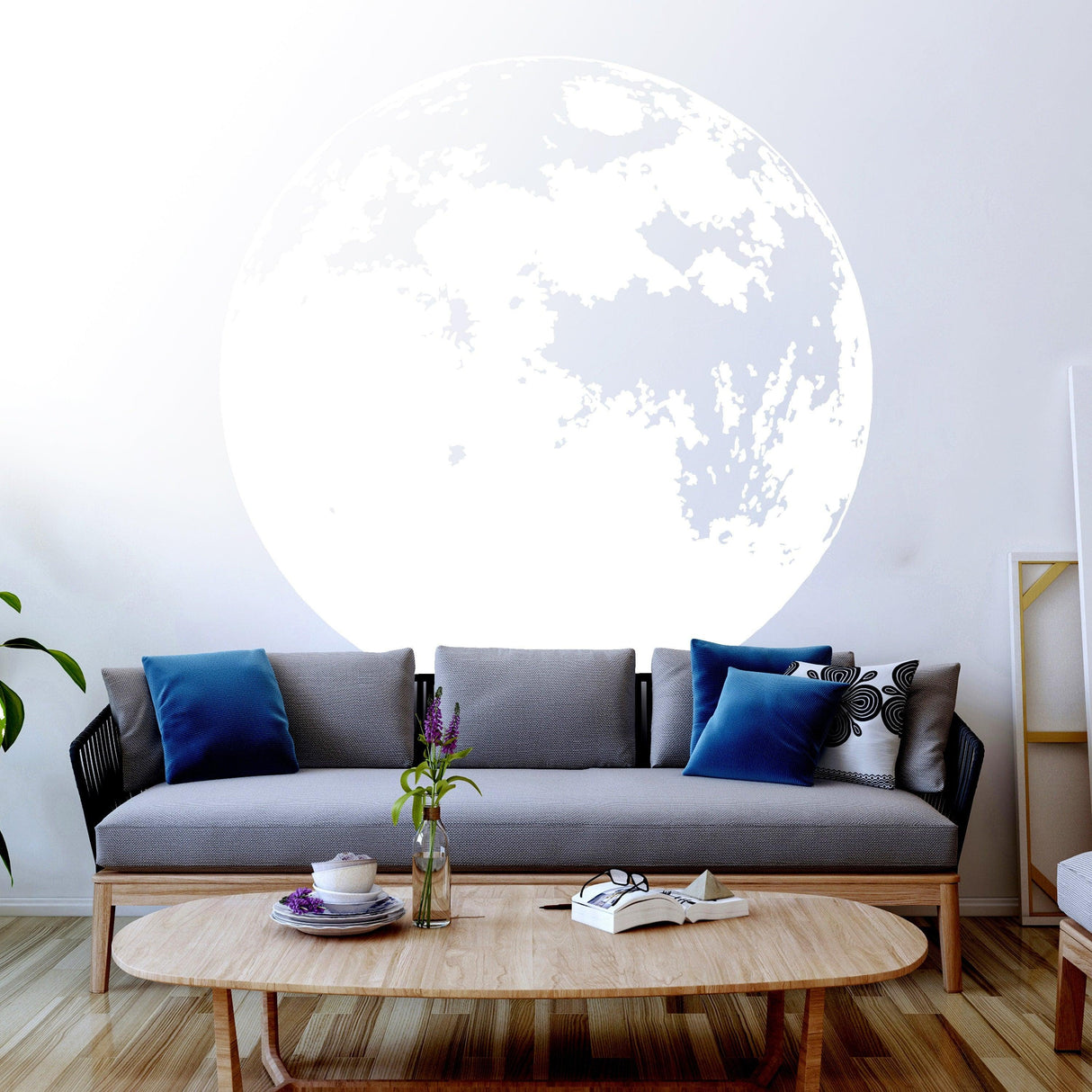 Glow in the dark moon wall sticker above a cozy sofa, enhancing the bedroom's dreamy decor.