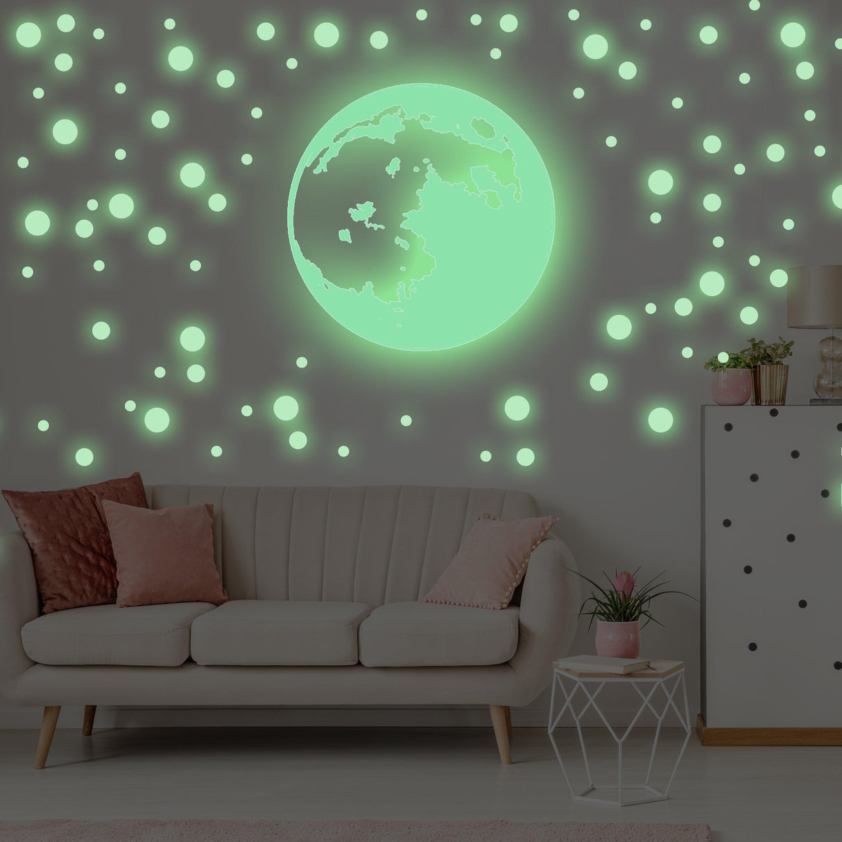 Glow in the dark moon and stars wall sticker illuminating a stylish kid's room for a dreamy atmosphere.