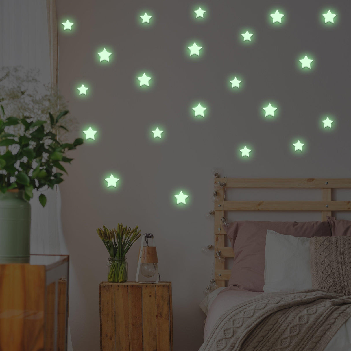 Glow in the dark star stickers on bedroom wall, creating a magical night sky effect for kids' room decor.