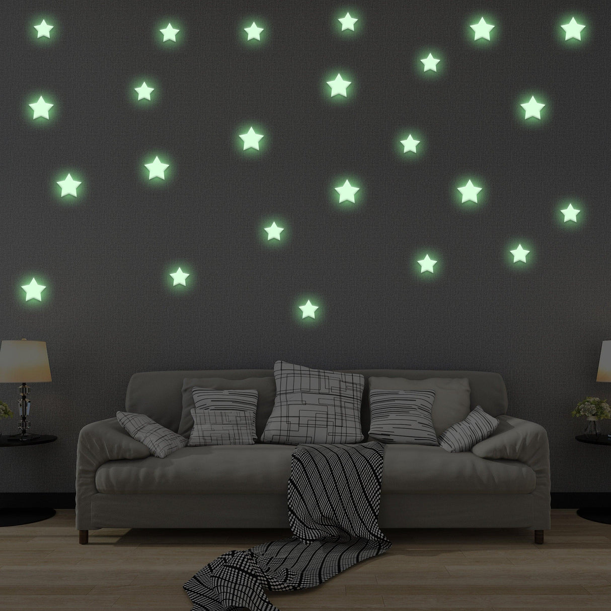 Glow in the dark star stickers on a dark wall above a cozy couch, creating a magical room decor for kids.