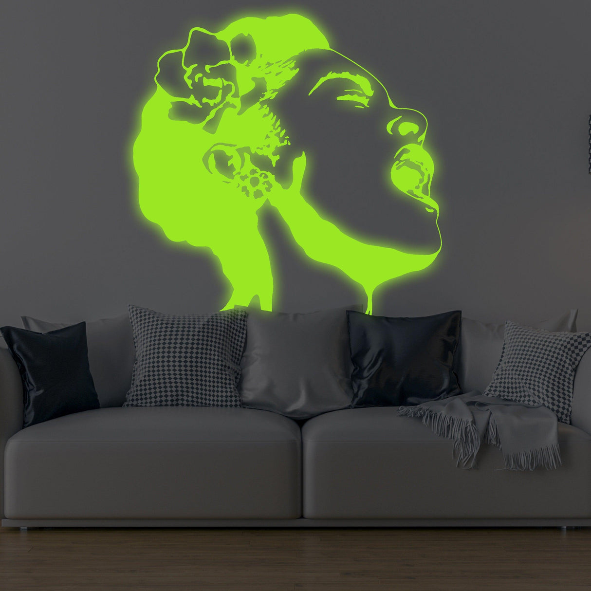 Glow in dark Banksy street art decal of a singing woman, radiating neon glow above a stylish couch.