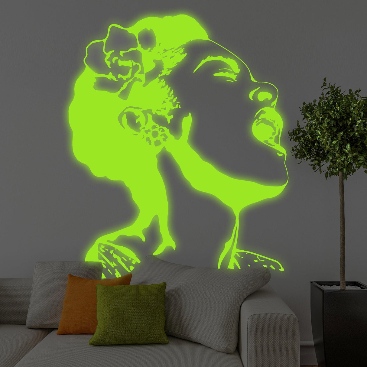 Glow in the dark Banksy street art decal of a singing woman in neon green on a modern living room wall.