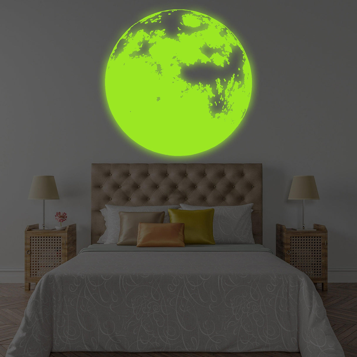 Glow in the dark moon wall decal above a cozy bed, perfect for a nursery or kids' room night light decor.