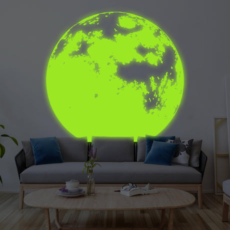 Glow in dark moon wall decor decal illuminating a nursery, creating a magical night light effect.