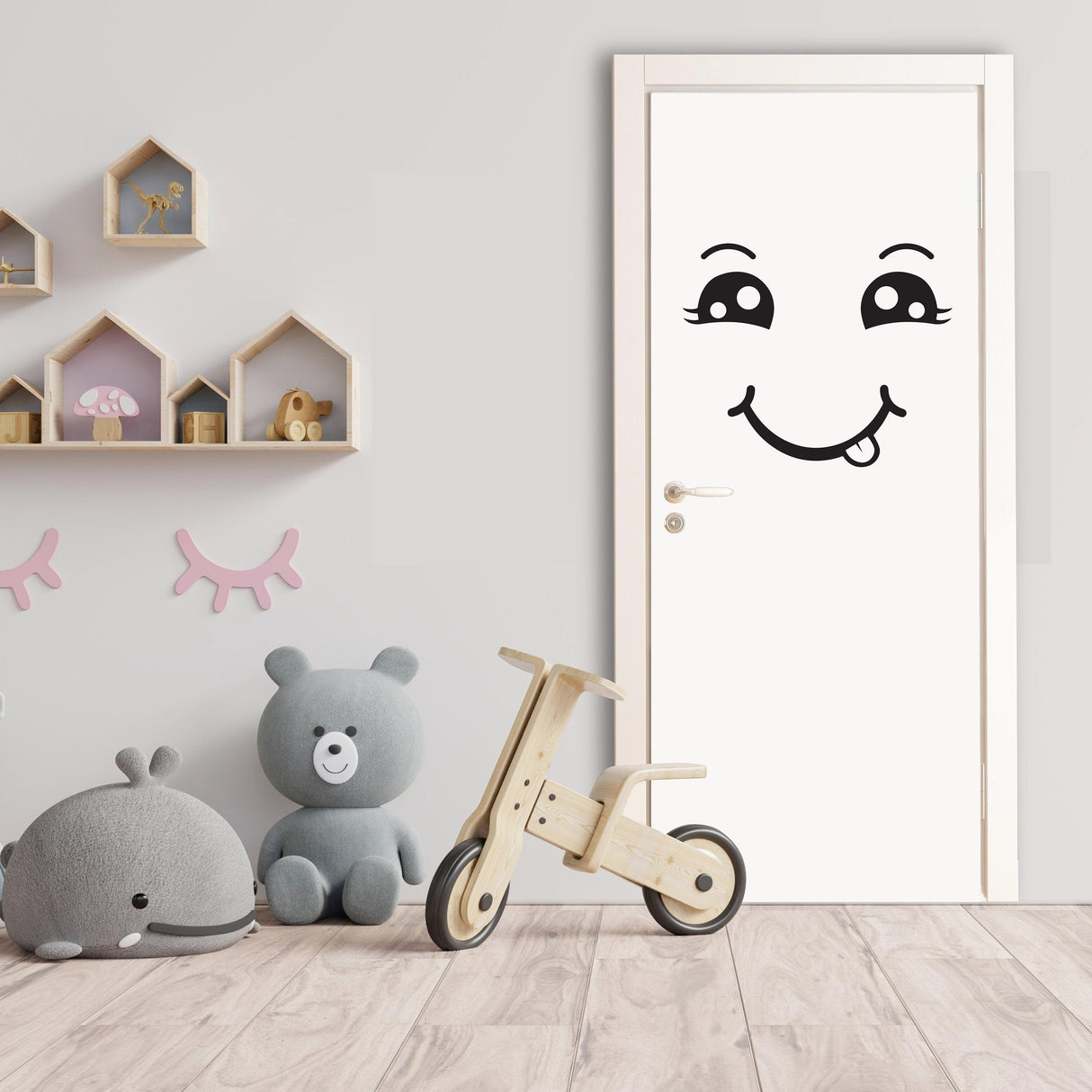 Happy face decal on a door in a playful children's room, surrounded by toys and decor.