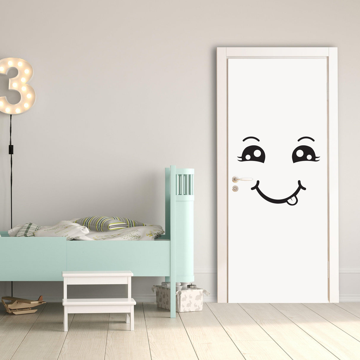 Happy face decal on a white door, perfect for adding cheer to a child's room decor.