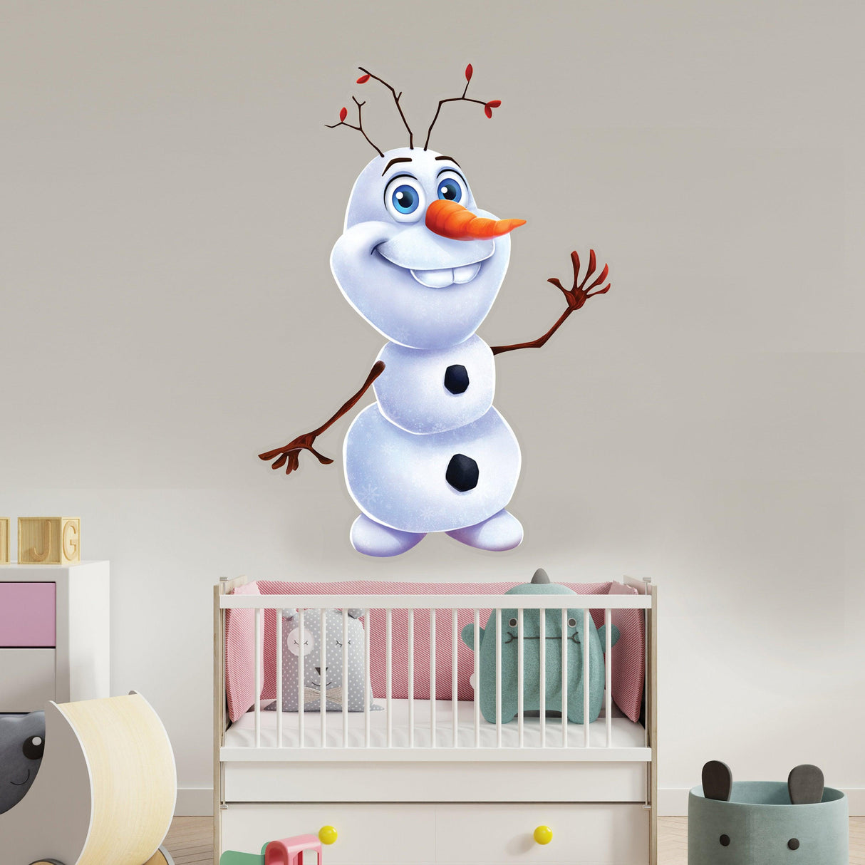Cheerful snowman wall sticker adding joy to a nursery with playful decor.