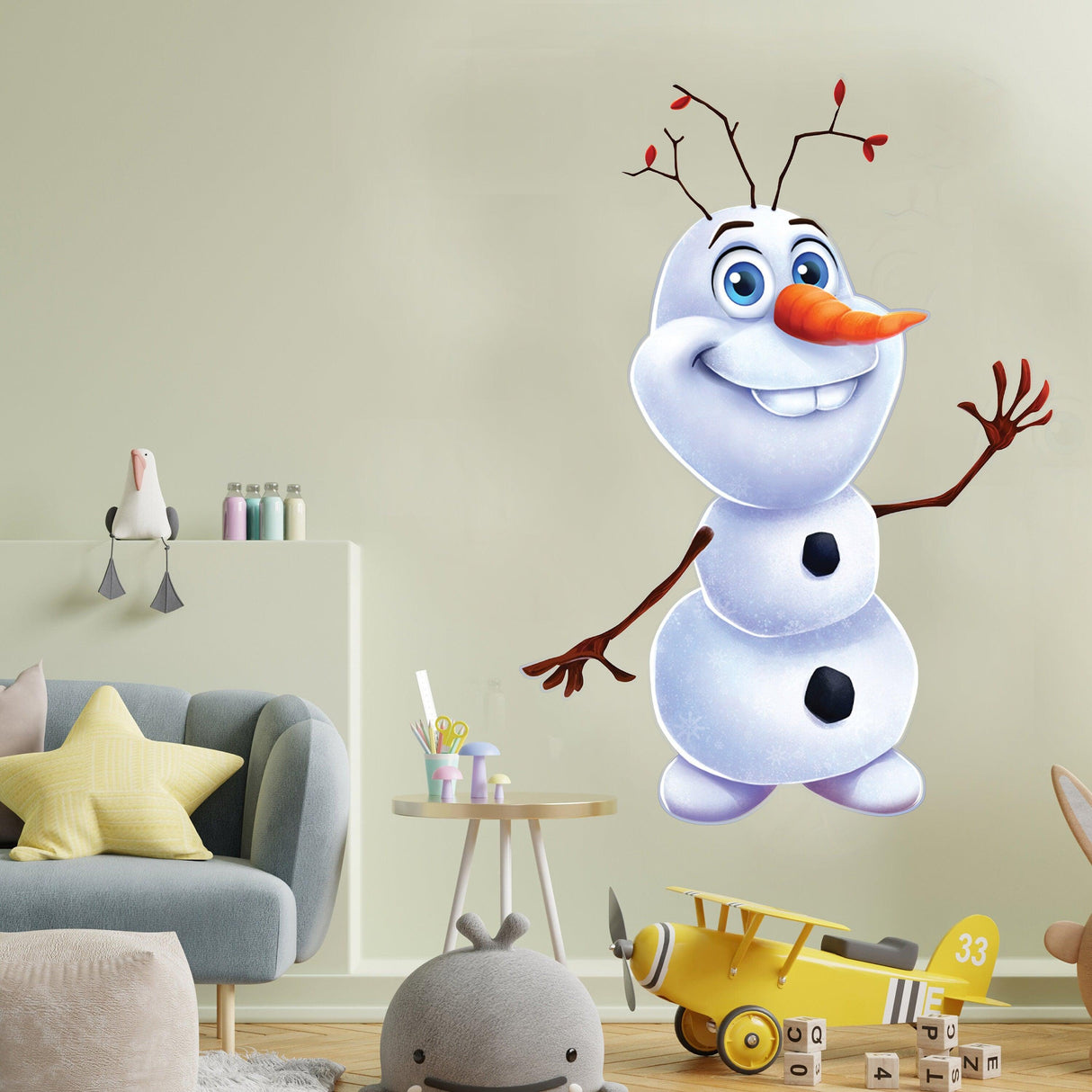 Cheerful snowman wall sticker decoration adding holiday spirit to a child's room, featuring a happy snowman with a carrot nose.