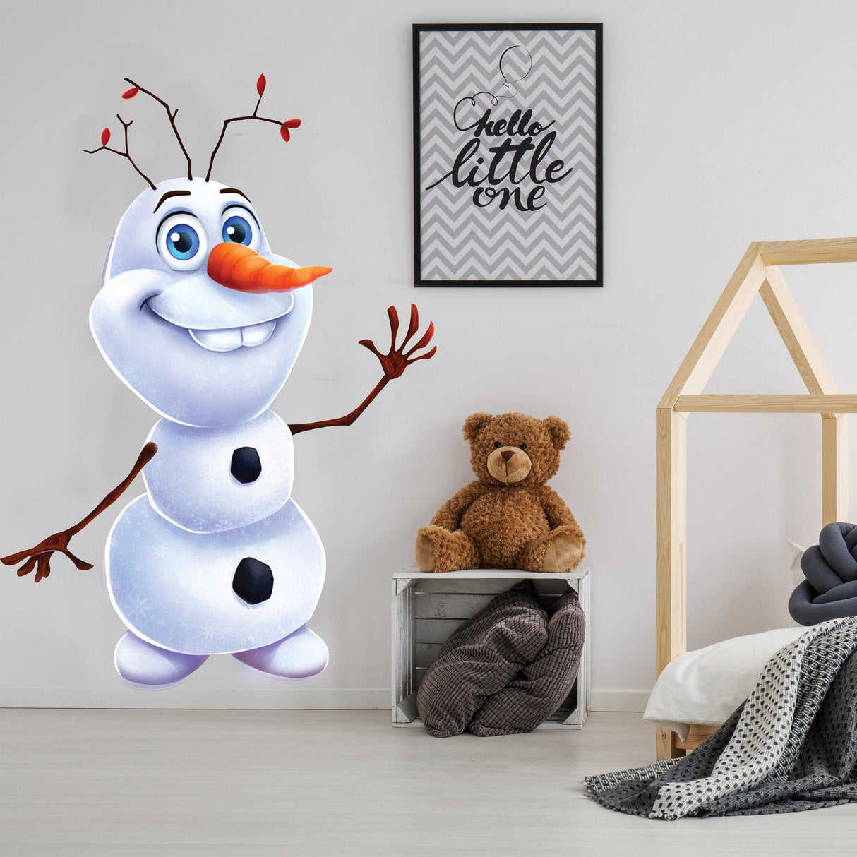 Cheerful snowman wall sticker in a stylish nursery, perfect holiday decor for kids' rooms.