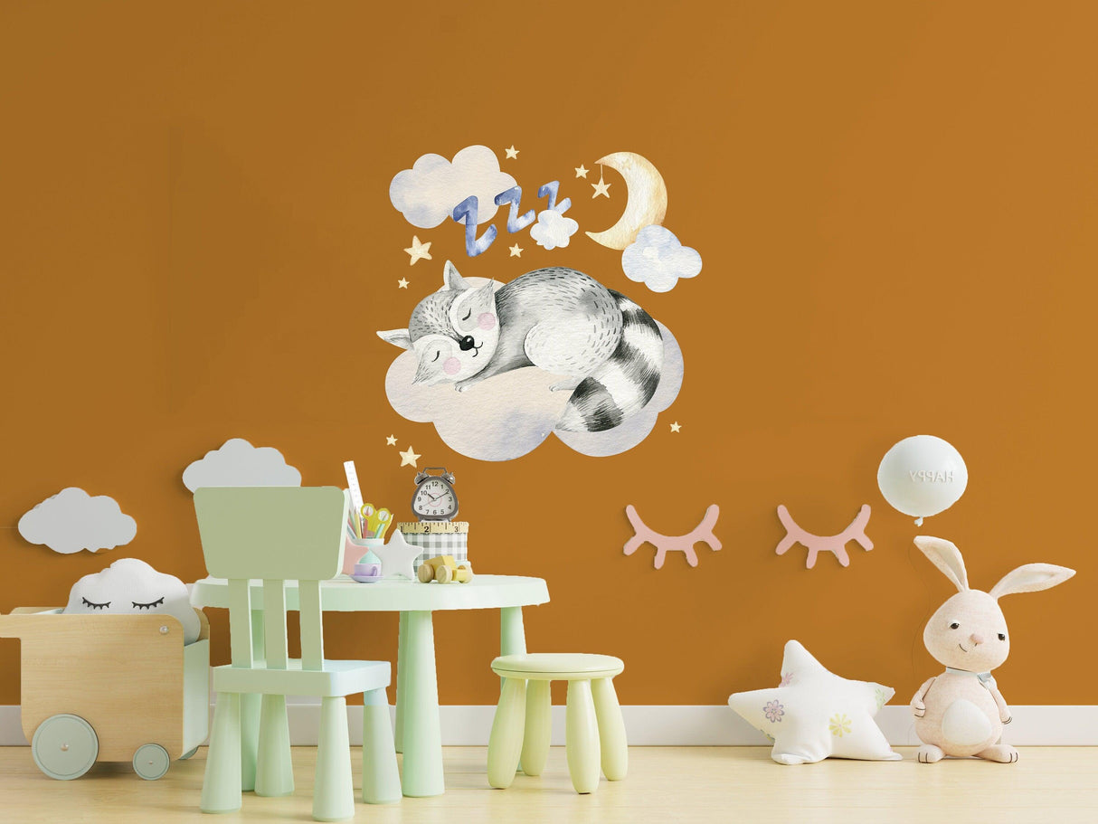 Whimsical baby nursery wall sticker with a raccoon on a cloud, stars, and moon on a warm orange backdrop.