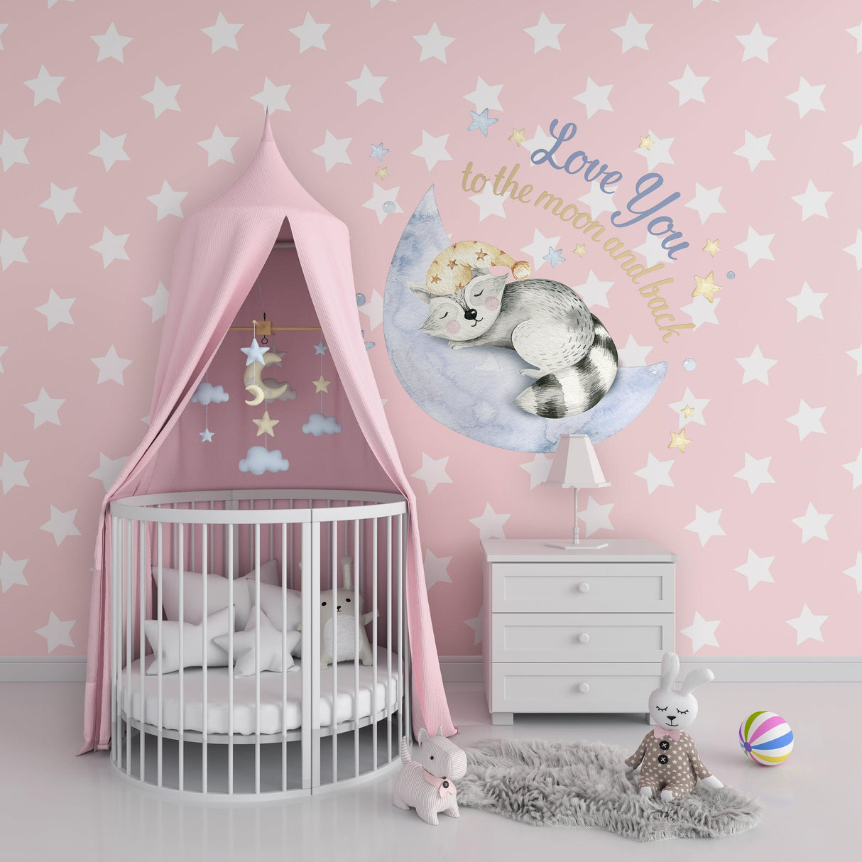 Baby nursery wall with a cute cat decal, stars, and pastel decor for a dreamy atmosphere.