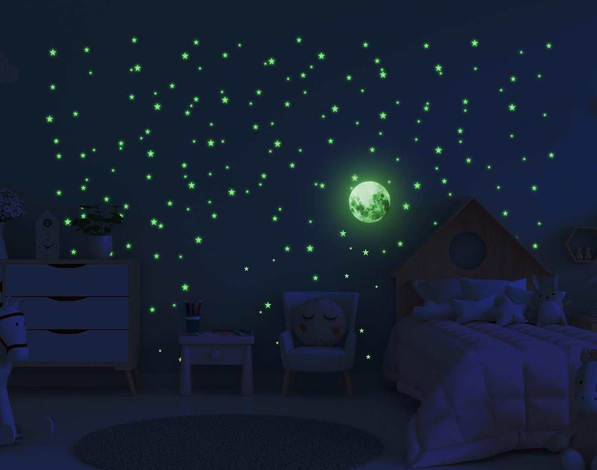 Glowing moon decal and glow-in-the-dark stars on bedroom wall, creating a magical starry night effect.