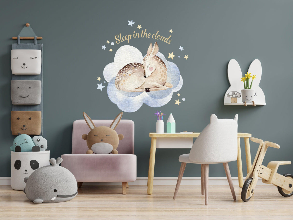 Nursery interior with animal cloud wall sticker, cozy decor for kids' room featuring playful elements.