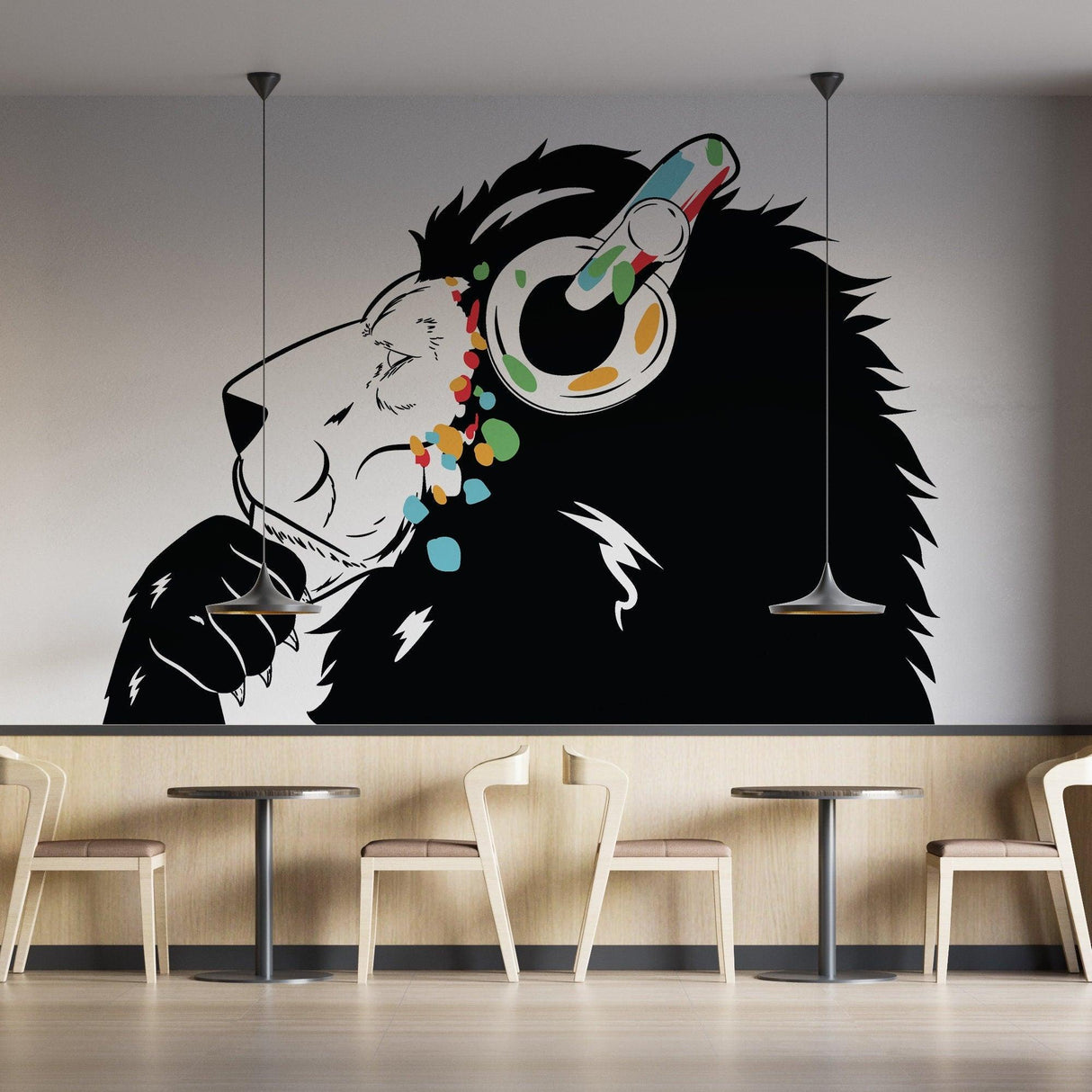 Lion wearing colorful headphones wall decal in modern cafe setting, inspired by Banksy graffiti style.