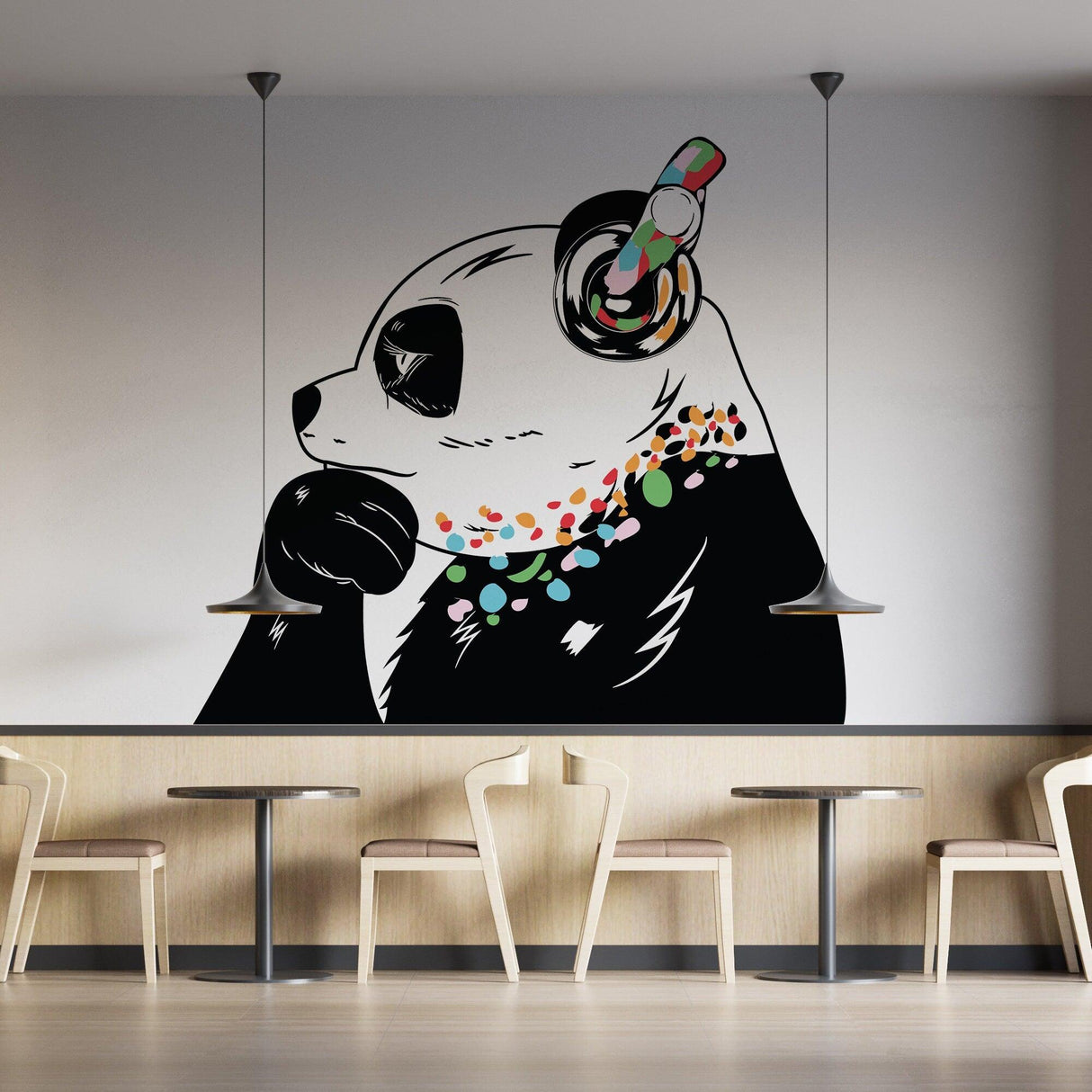 Panda in headphones wall decal, inspired by Banksy's graffiti art, adds whimsy to modern decor.