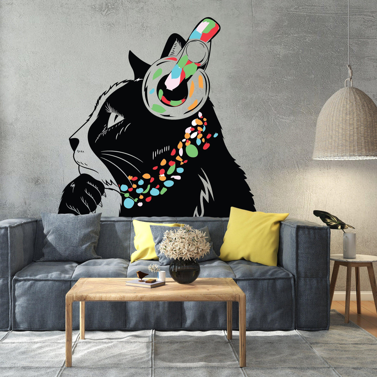 Decorative cat wall sticker featuring a colorful design on a living room wall above a stylish sofa.