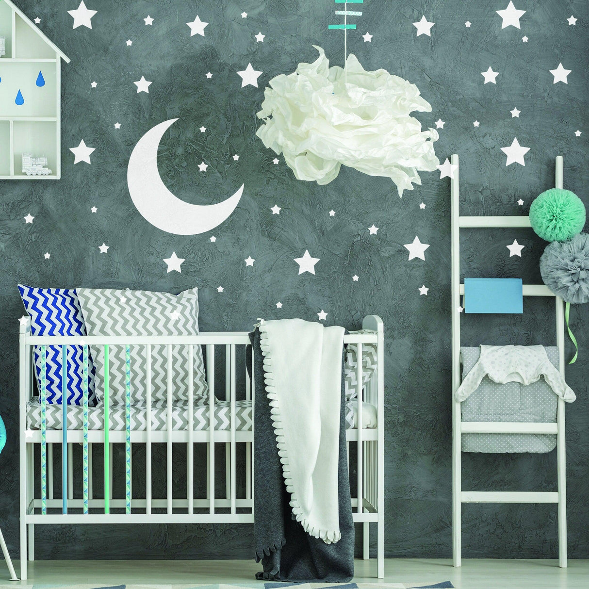 Nursery with stars wall decals and moon decoration, featuring a crib and playful cloud light.