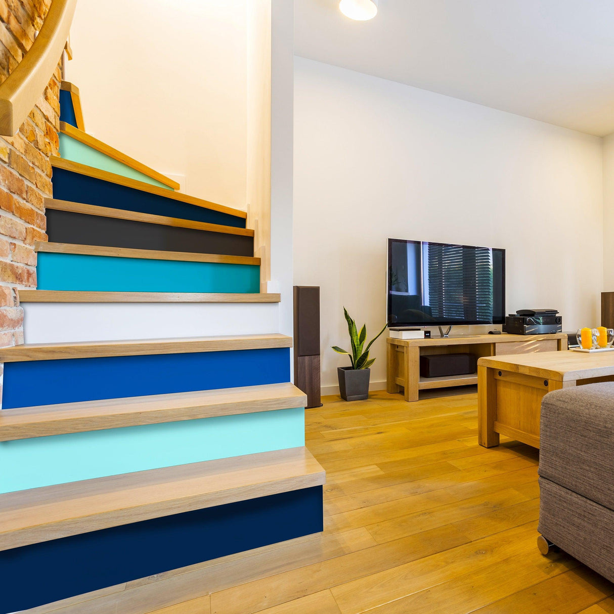 Gradient color self-adhesive stair riser stickers transforming a modern staircase in a stylish living room.