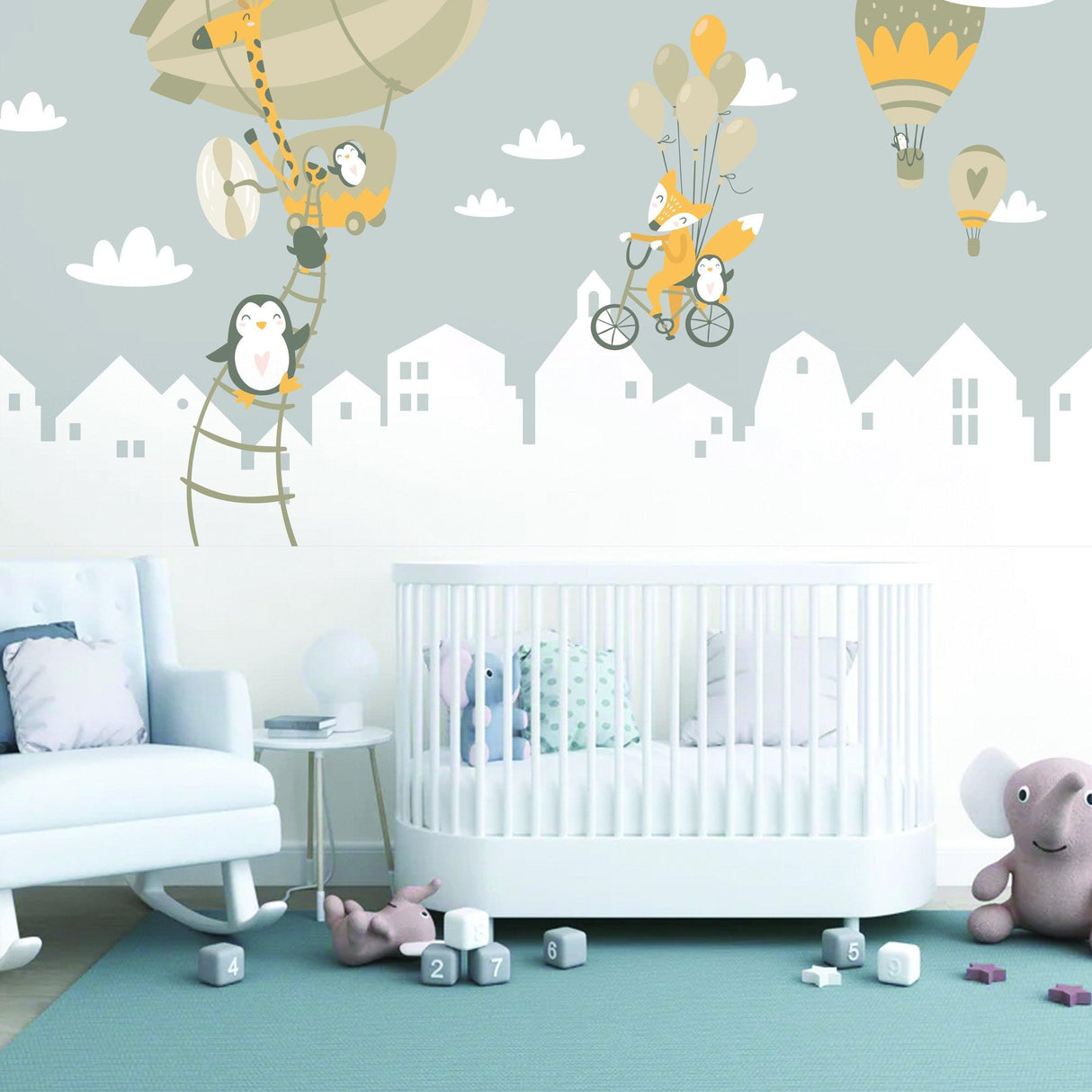 Whimsical penguins and fox wall stickers in a nursery with colorful balloons and playful hot air balloons.