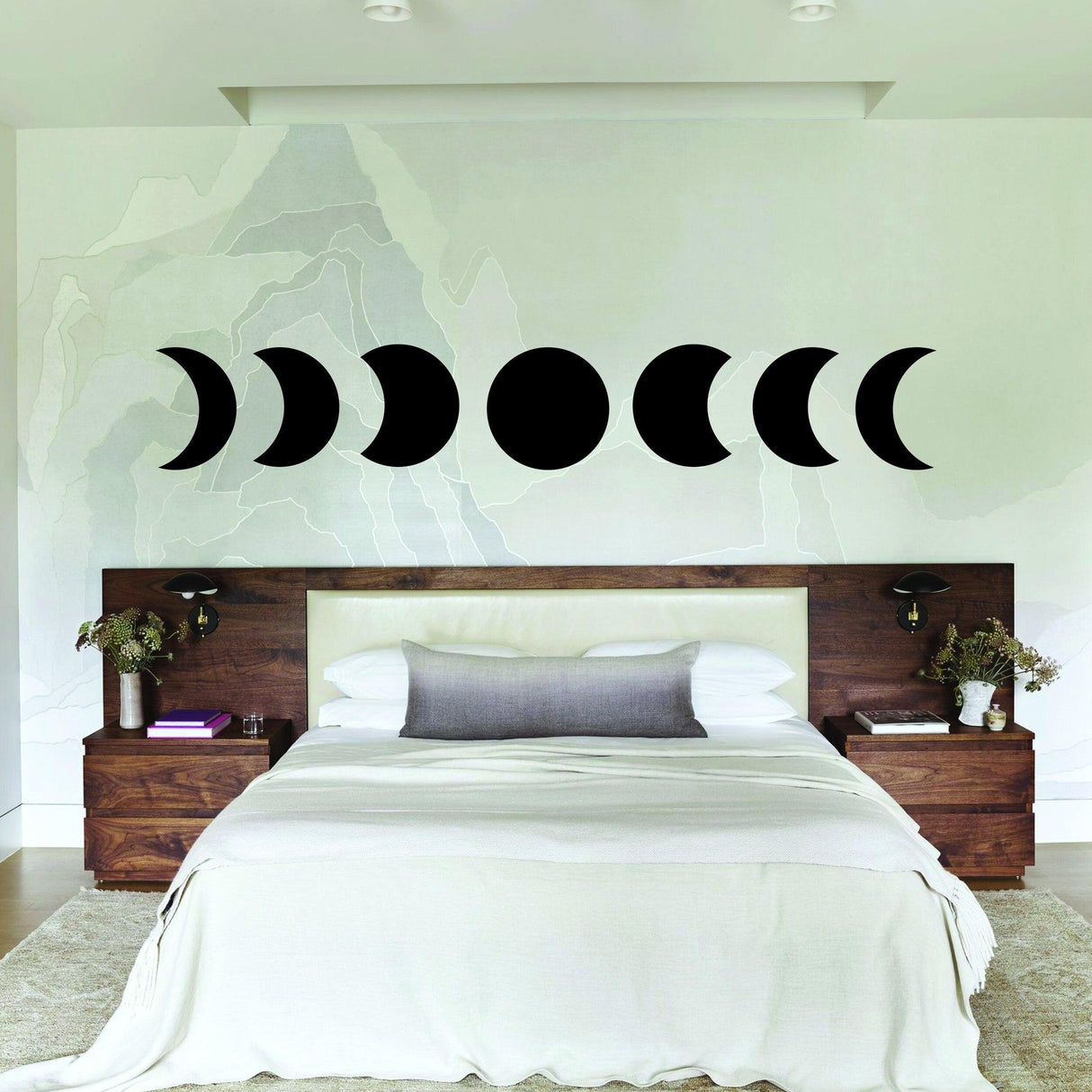 Moon Phase Wall Decor Sticker above bed in stylish bedroom, showcasing intricate moon phases vinyl decal.